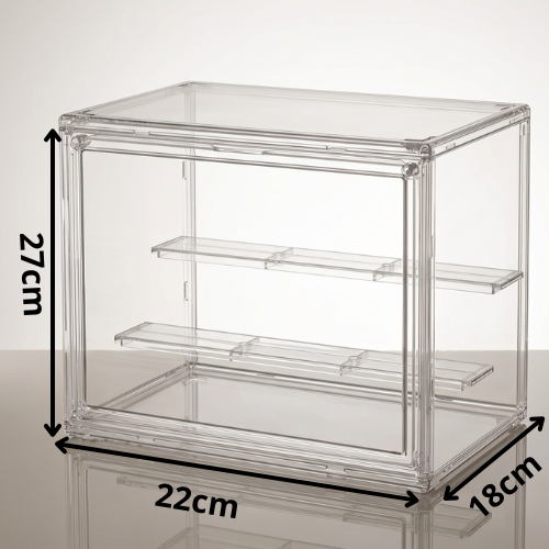 Clear acrylic display box with three shelves, shown with dimension labels indicating 27 cm height, 22 cm width, and 18 cm depth on a light gray background.