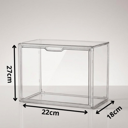 Clear acrylic storage box with dimension annotations showing 27 cm height, 22 cm width, and 18 cm depth on a light gray background.